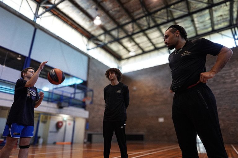 Harbour City basketball Trainer Keeto Browne session with two boys
